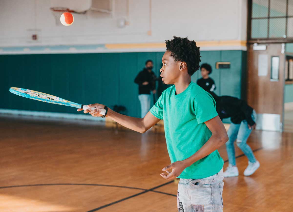 Nash-Student-playing-tennis